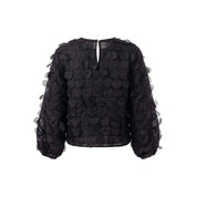 Semi-sheer blouse with 3D dots that create a playful texture. Round neckline with a back closure.